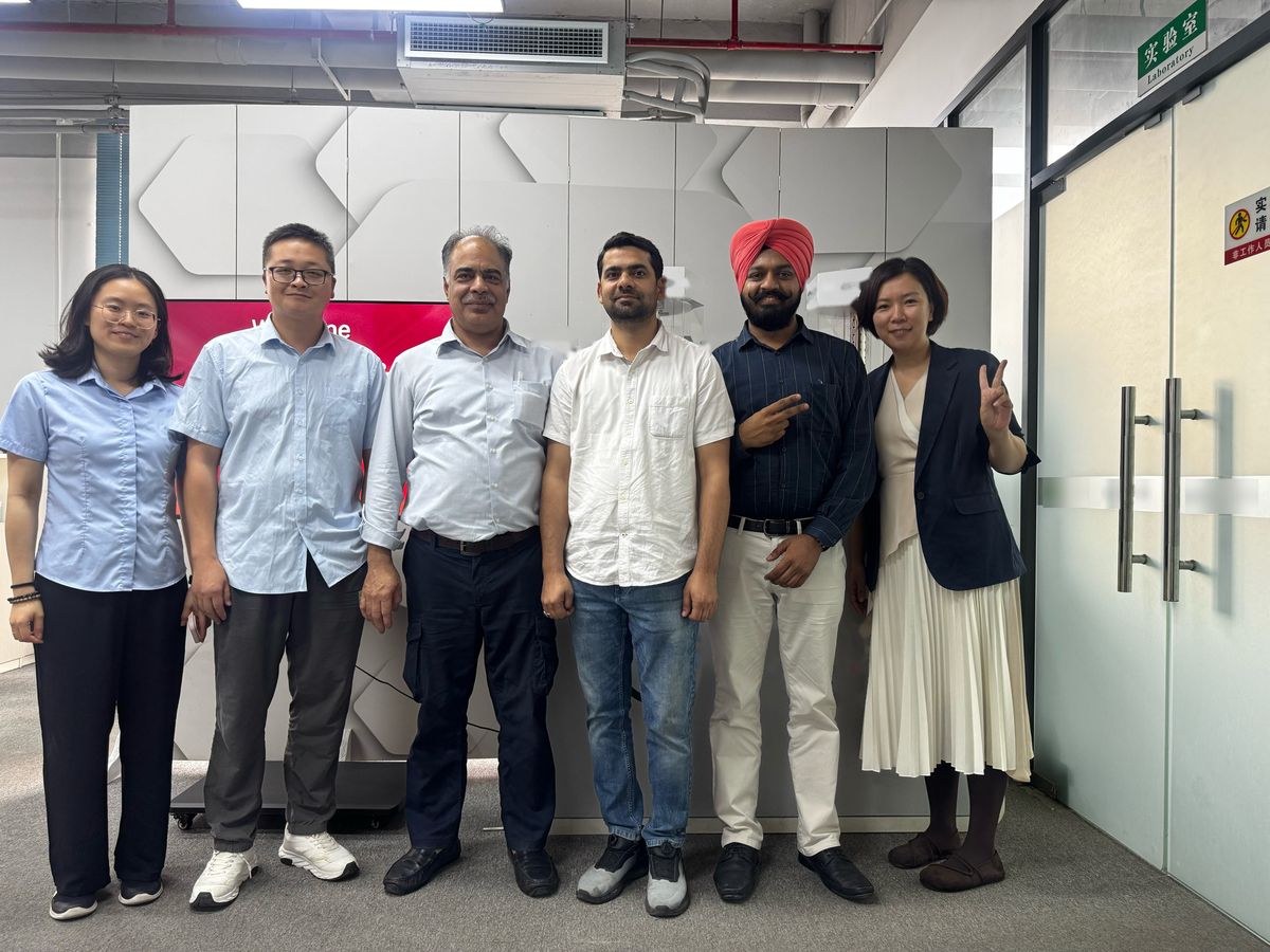 Group photo with visiting buyers at a supplier's laboratory entrance