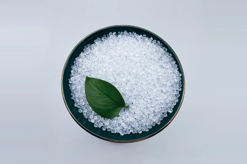 Translucent EVA resin pellets in a dish